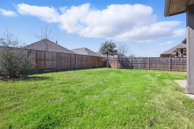 view of yard with a fenced backyard