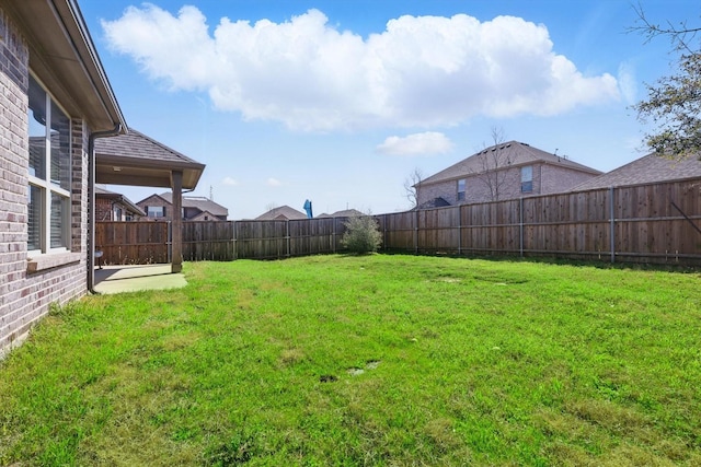 view of yard featuring a fenced backyard