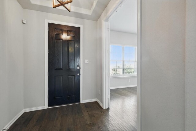 entrance foyer featuring dark wood-style floors and baseboards