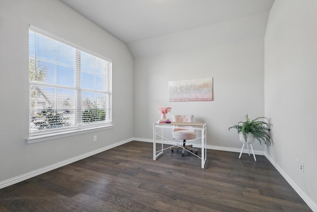 home office featuring baseboards, lofted ceiling, and wood finished floors