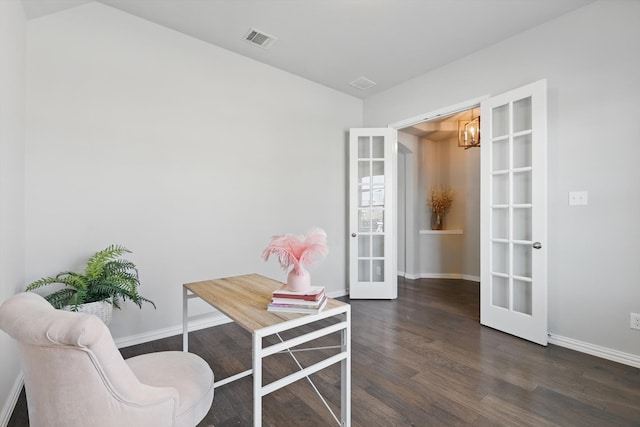 living area featuring wood finished floors, visible vents, baseboards, an inviting chandelier, and french doors