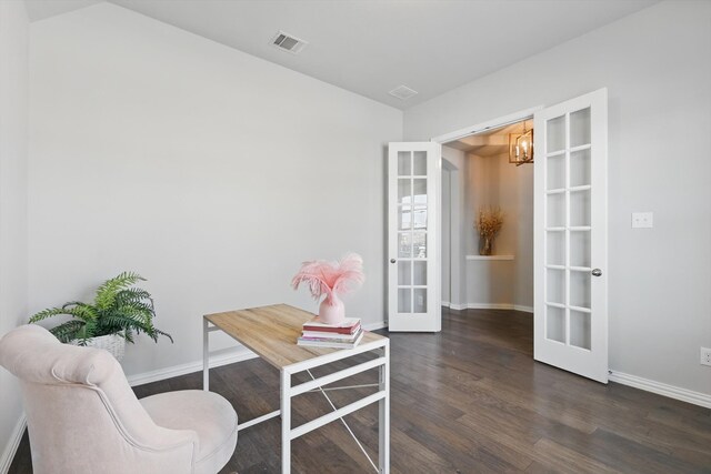 office space with a notable chandelier, visible vents, baseboards, french doors, and wood finished floors