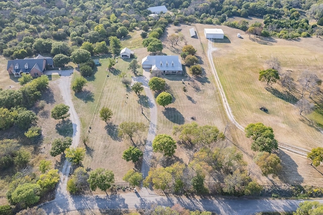 birds eye view of property with a rural view