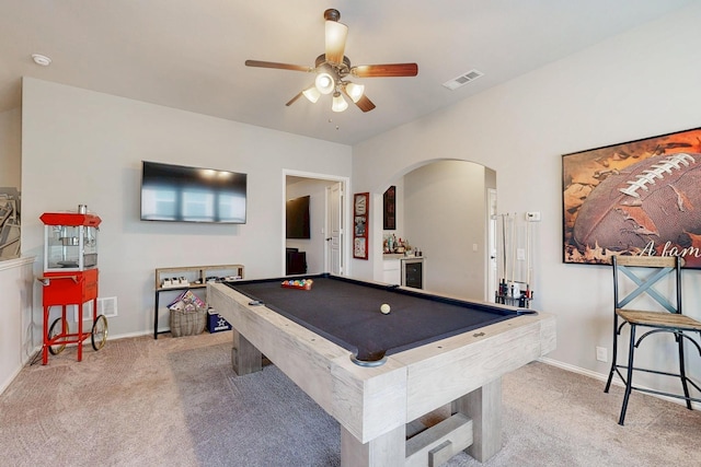 rec room with carpet, arched walkways, visible vents, a ceiling fan, and billiards