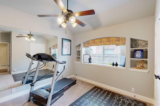 exercise area featuring lofted ceiling, carpet, baseboards, and built in features