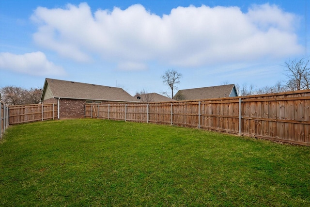 view of yard featuring a fenced backyard