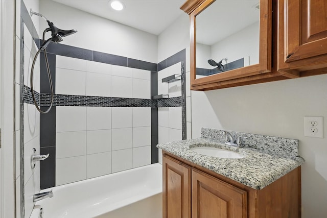 bathroom with tub / shower combination and vanity