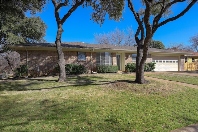 single story home with a garage, brick siding, driveway, and a front lawn