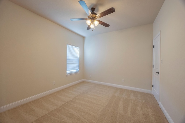 unfurnished room featuring light carpet, ceiling fan, and baseboards