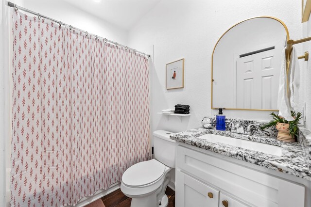 full bath with wood finished floors, vanity, toilet, and a shower with curtain