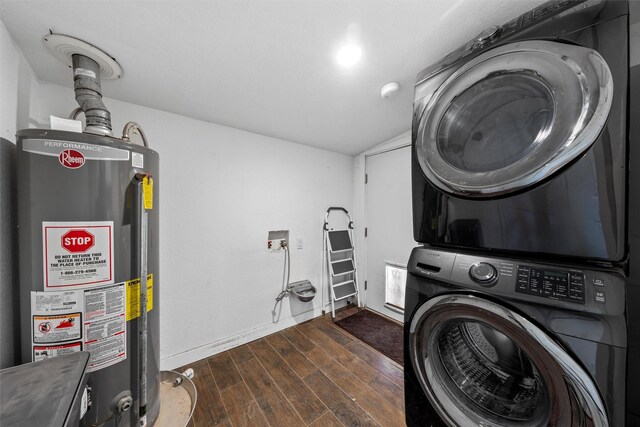 laundry room featuring laundry area, dark wood-style flooring, gas water heater, and stacked washing maching and dryer