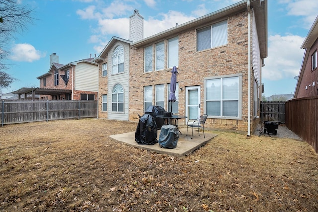 2509 Cross Haven Dr, Flower Mound, TX 75028 - back of house with a patio area, brick siding, and a chimney