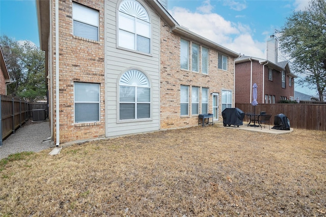2509 Cross Haven Dr, Flower Mound, TX 75028 - rear view of house featuring brick siding, a fenced backyard, a patio area, and central AC unit