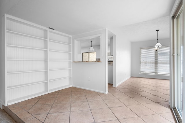 interior space featuring a healthy amount of sunlight, visible vents, and light tile patterned floors