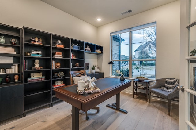 home office featuring recessed lighting, visible vents, and light wood finished floors