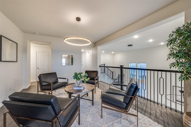 sitting room featuring recessed lighting, a healthy amount of sunlight, and baseboards