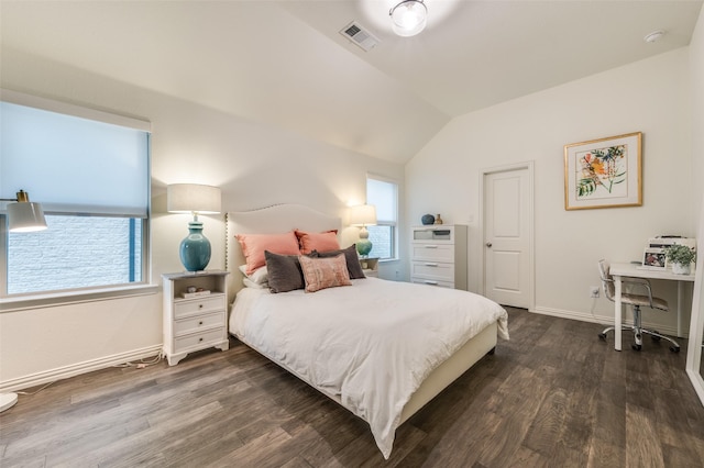 bedroom featuring visible vents, multiple windows, dark wood finished floors, and vaulted ceiling