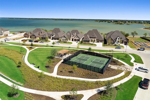 birds eye view of property with a residential view and a water view