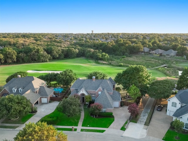 birds eye view of property with golf course view