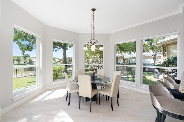 sunroom / solarium featuring an inviting chandelier