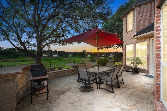 view of patio / terrace featuring outdoor dining space and fence