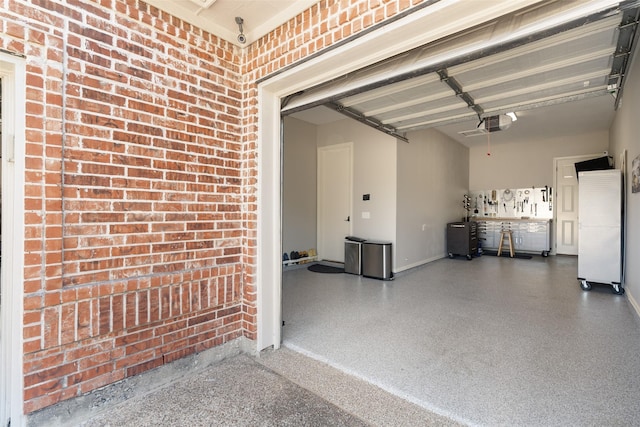 garage with baseboards and a garage door opener