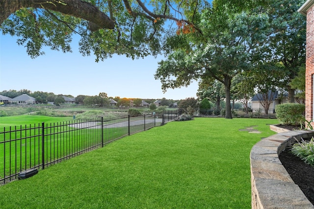 view of yard with a fenced backyard