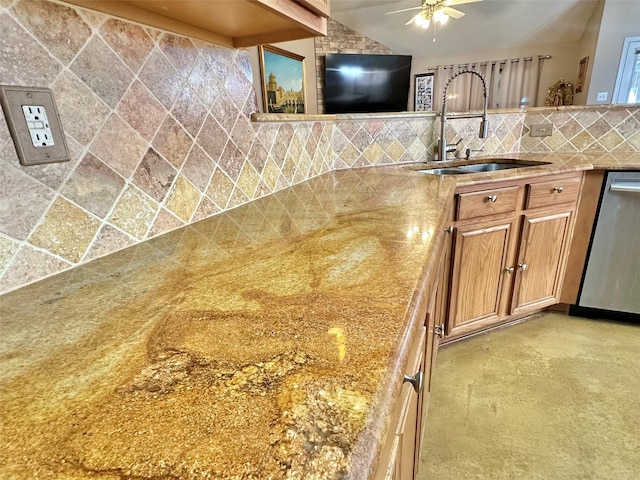 kitchen featuring dishwasher, lofted ceiling, ceiling fan, a sink, and backsplash