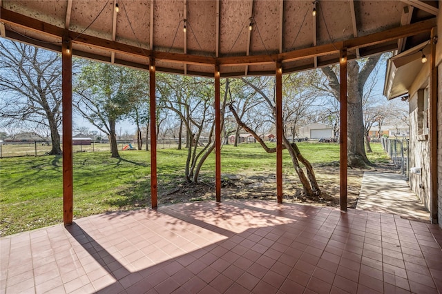 view of patio featuring fence and a gazebo