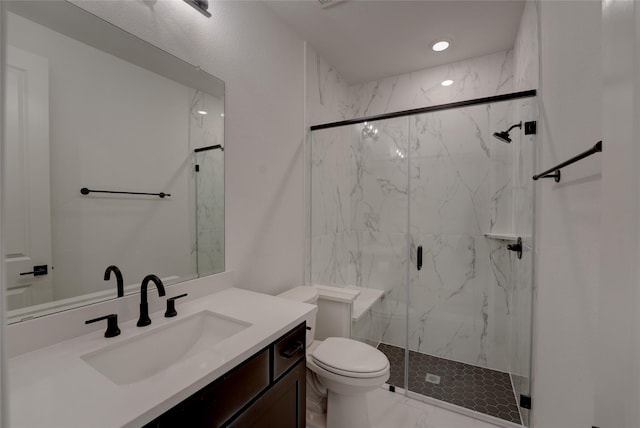 bathroom with marble finish floor, toilet, vanity, and a marble finish shower