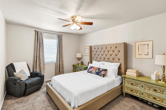 bedroom with ceiling fan, a textured ceiling, and carpet flooring