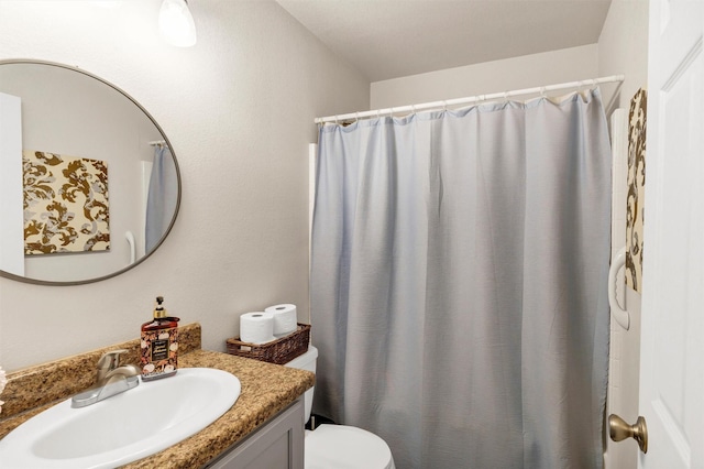 full bath featuring curtained shower, vanity, and toilet