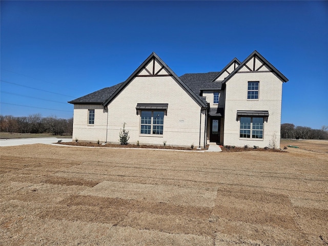 view of front of home with brick siding