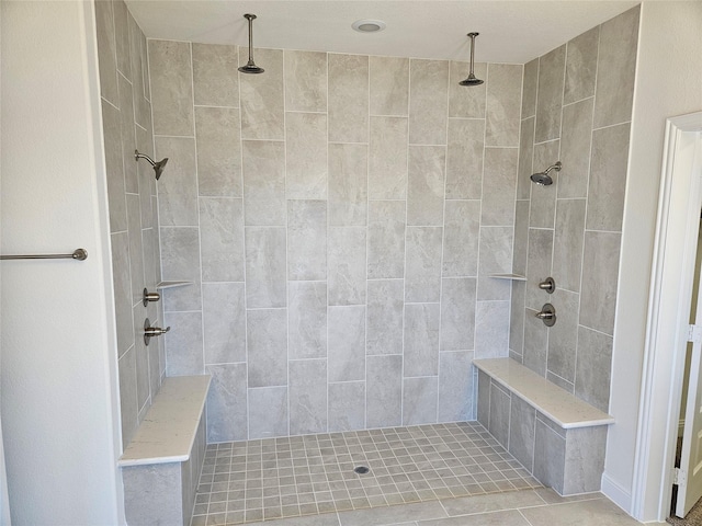 bathroom with a tile shower