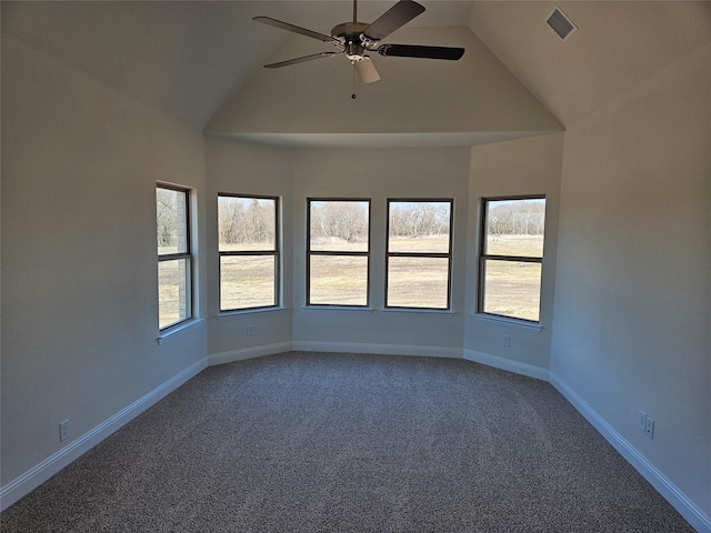 spare room with baseboards, visible vents, ceiling fan, dark carpet, and high vaulted ceiling