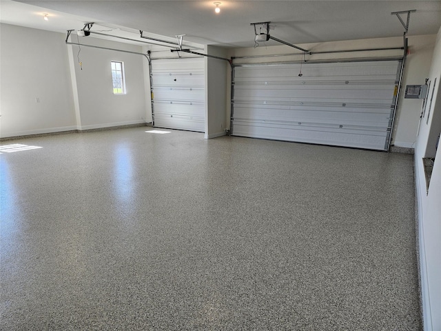 garage with baseboards and a garage door opener