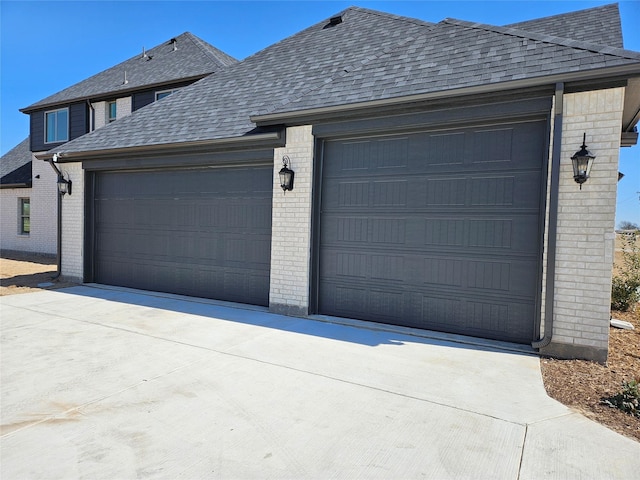 garage featuring driveway