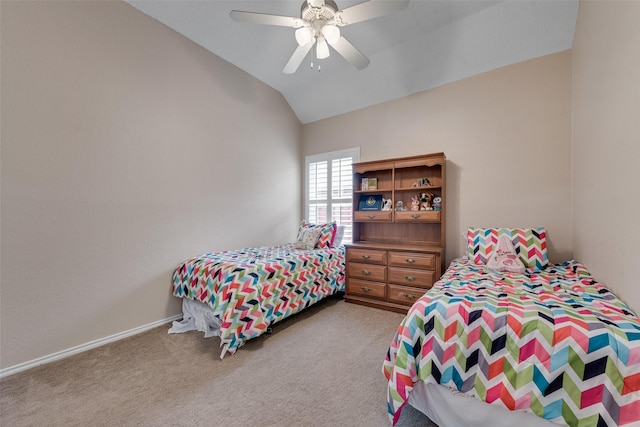 bedroom with vaulted ceiling, a ceiling fan, and light colored carpet