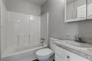 bathroom with shower / tub combination, vanity, and toilet