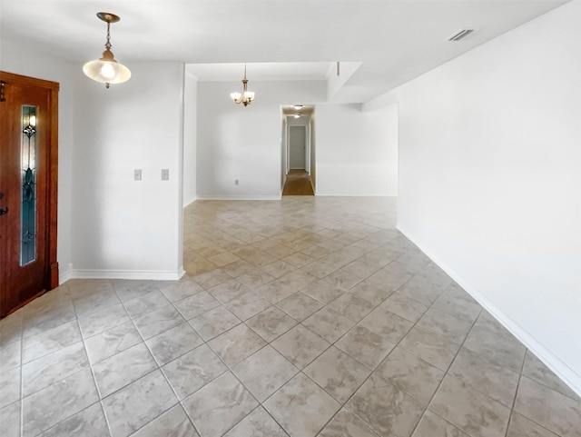 unfurnished room featuring visible vents, baseboards, a chandelier, and light tile patterned flooring