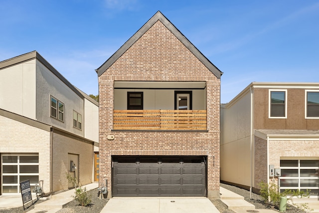 view of front facade with a garage, concrete driveway, brick siding, and a balcony