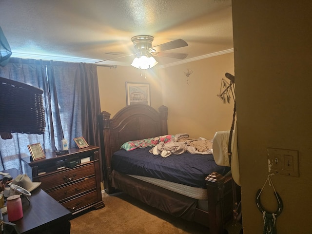 bedroom with carpet, ornamental molding, and a ceiling fan