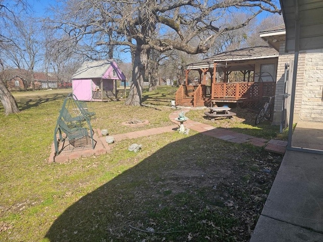 view of yard featuring a deck