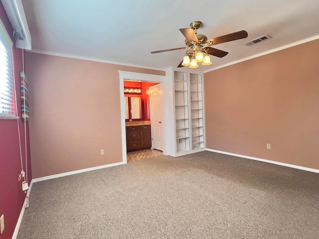 unfurnished bedroom with ornamental molding, light colored carpet, visible vents, and baseboards