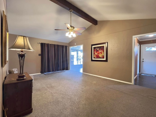 unfurnished living room featuring vaulted ceiling with beams, carpet, baseboards, and a ceiling fan