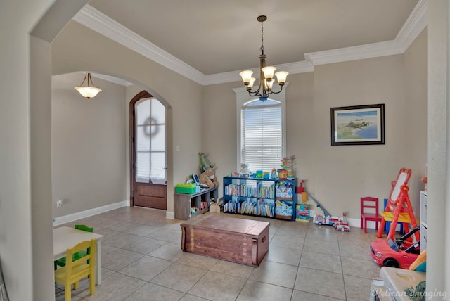 game room featuring crown molding, arched walkways, and plenty of natural light