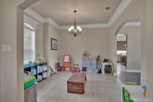 playroom featuring light tile patterned floors, visible vents, arched walkways, wine cooler, and crown molding