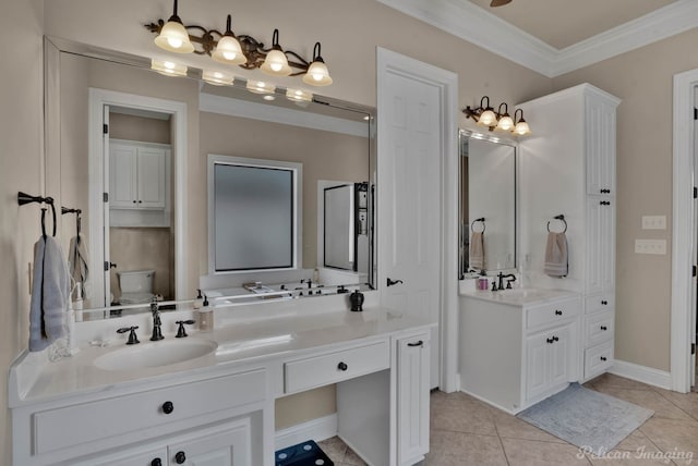 bathroom with toilet, tile patterned flooring, vanity, and crown molding