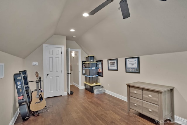 additional living space featuring recessed lighting, wood finished floors, a ceiling fan, baseboards, and vaulted ceiling