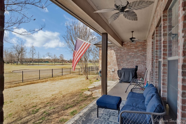 view of patio / terrace featuring ceiling fan and a fenced backyard